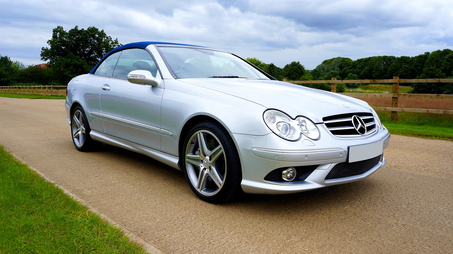 Silver Mercedes-Benz convertible photographed outdoors